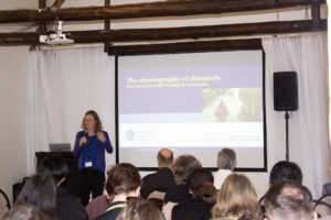 Woman giving a presentation at a conference