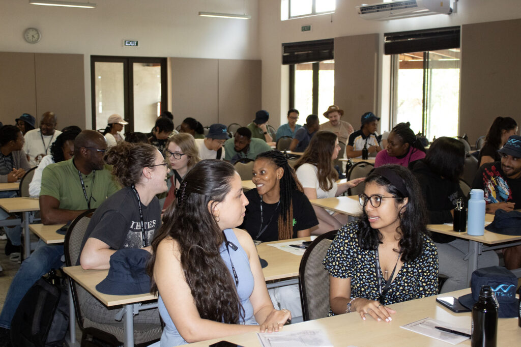 Grad students conversing in pairs