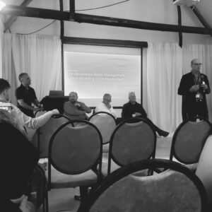 A group of 5 men in a panel discussion